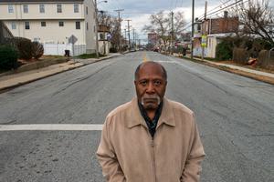 Marvin Thomas, a longtime civic activist, stands at a Southbridge intersection that has flooded repeatedly in recent years.