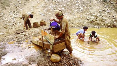 Miners pan for gold near San Juanito, Bolivia.