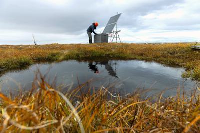 Jacqueline Hung, researcher at the Woodwell Climate Research Center, measures permafrost emissions in Prudhoe Bay, Alaska.