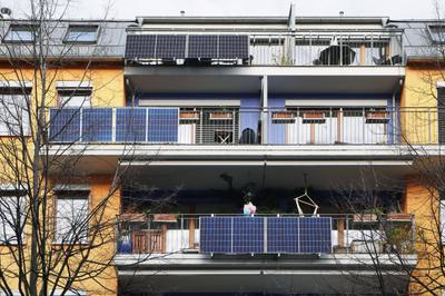 Solar panels hang from balconies in Berlin, Germany.