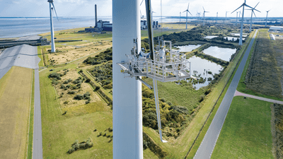 Workers paint a turbine blade black in an effort to deter birds in Eemshaven, the Netherlands.