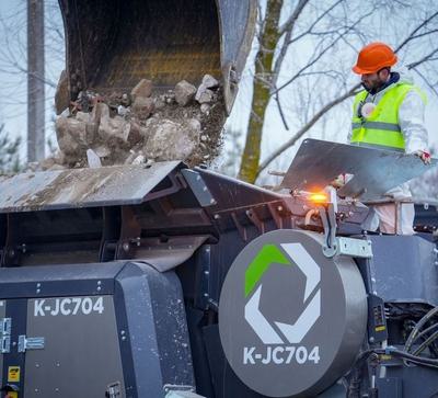 Rubble is broken down at a recycling station in Bucha.
