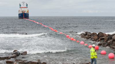 Laying electric cable at the test site of the European Marine Energy Centre in Scotland’s Orkney Islands. The center allows wave-power companies to connect their devices to existing infrastructure and cabling to test their electricity-generating capabilities and identify problems with their technologies.