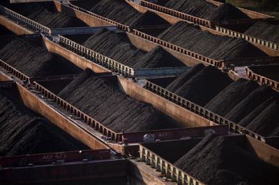 Coal barges on the Monongahela River near the Clairton Coke Works in Clairton, Pennsylvania.