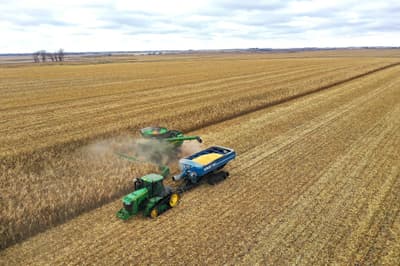 A combine harvesting corn near McIntire, Iowa.