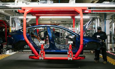 A Tesla Model 3 electric car being built in Fremont, California in 2018.