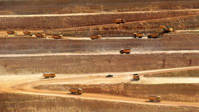 Trucks hauling coal at a Chinese-financed open-pit mine in Pakistan's Sindh province in May 2018.
