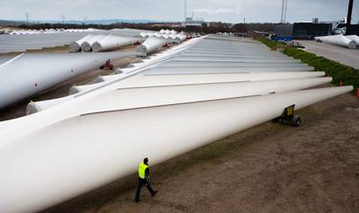 Wind turbine blades ready to be shipped from a storage facility in Aalborg, Denmark.