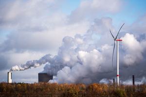 A wind turbine operating next to the Niederaussem coal-fired power plant near Bergheim, Germany.