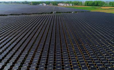 'Green Grab': Solar and Wind Boom Sparks Conflicts on Land Use A solar farm in China's Hubei Province.