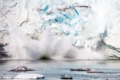 Ice breaks away from the Apusiajik Glacier, near Kulusuk.