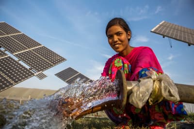 A farm worker uses a solar-powered water pump in the village of Jagadhri in northern India.