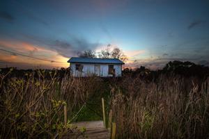 Islanders estimate that about half of the population have already moved from Isle de Jean Charles, including 42-year-old Keith Brunet, who moved his wife and two children from this house to Houma. He had mucked enough mud out of his house from hurricanes to call it quits on his island home. "You get tired of it," he said in February 2018.