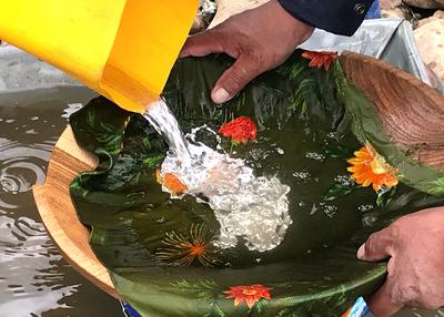 Left: Mercury is poured by miners on a clump of earth to amalgamate gold particles. Right: A lump of gold and mercury.