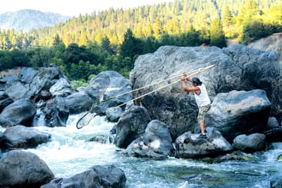 A Win for Farmers and Tribes Brings New Hope to the Klamath A Karuk tribal member fishes for salmon on the Klamath River.