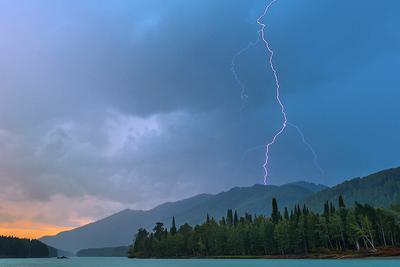Lightning over the Katun River in Siberia, August 5, 2014.