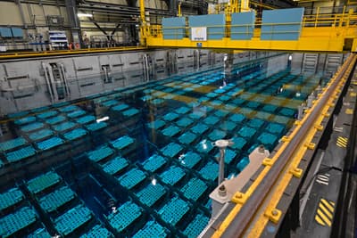 Spent nuclear fuel stored underwater at a reprocessing plant in La Hague, France.
