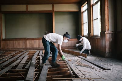 Wooden planks are salvaged from a community center in Hida, Japan.