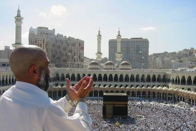 A pilgrim at the Great Mosque of Mecca in Mecca, Saudi Arabia.