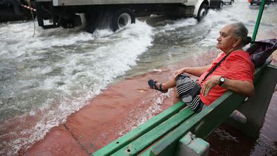 In Miami Beach (above), as elsewhere on the U.S. East Coast, flooding from seasonal high tides has been made worse in recent years by rising seas.