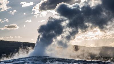 Old Faithful at sunset. As water reserves decline, the geyser is expected to erupt less frequently.