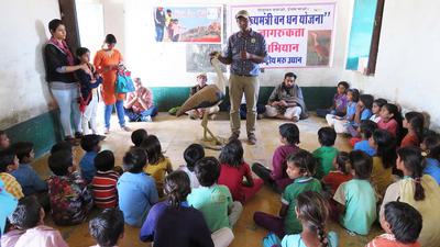 Dr. Pramod Patil talking to local school children about the importance of the great Indian bustard.