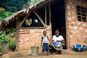 A mother and child in Sinoe County, Liberia, where a pilot project will pay villagers to protect their forest.