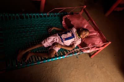 A Sudanese boy who was born blind and crippled, conditions his mother blames on her exposure to gold mining waste. Mercury exposure during pregnancy is known to damage fetal development.