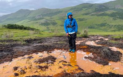 Ecologist Patrick Sullivan studies an acid seep in Alaska's Kobuk Valley National Park in 2023.