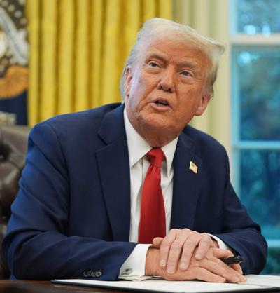 President Donald Trump signing an executive order on February 3, 2025.