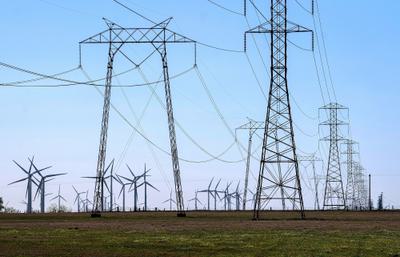 Wind turbines and transmission lines in Rio Vista, California.