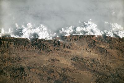 A satellite image of haze from cities in the Indus River Valley colliding with the Sulaiman Mountains in Pakistan.